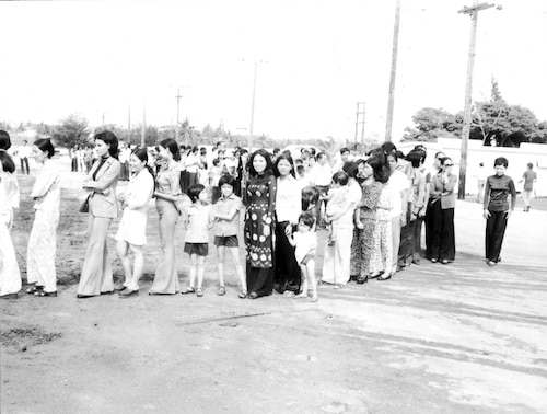 New Life refugees waiting in line at Andersen's “Tin City” barracks. (Photo courtesy of the 36th Wing History Office)