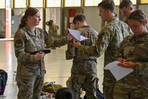 U.S. Air Force Tech. Sgt. Tasha Cobbs, 9th Force Support Squadron force management, in-processes Airmen arriving at Edwards Air Force Base, California, on Aug. 2, 2024.