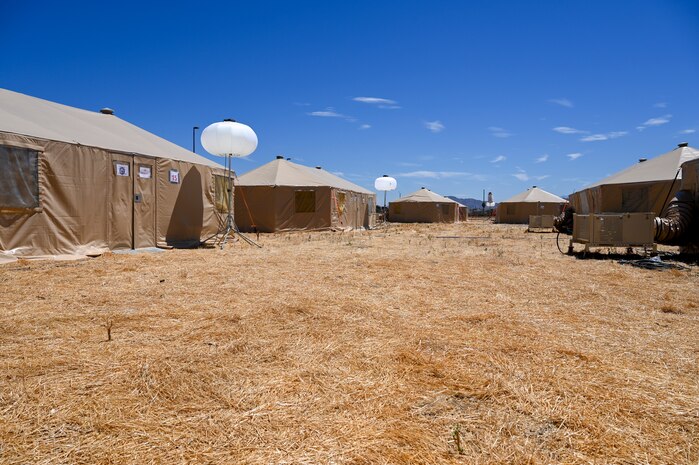 Rows of tents to house expeditionary Airmen during exercise AGILE FLAG 24-3 are set up on March Air Reserve Base, California on Aug. 4, 2024.