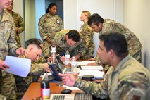 Airmen get in-processed during Exercise AGILE FLAG 24-3 at March Air Reserve Base, California, Aug. 4, 2024.