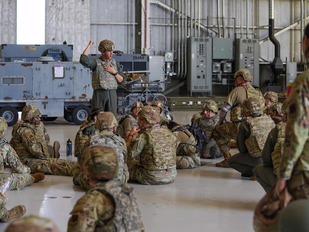 U.S. Air Force Col. Keagan McLeese, 9th Reconnaissance Wing commander, give directions to Airmen following a simulated attack during Exercise AGILE FLAG at Edwards Air Base, California, Aug. 8, 2024.