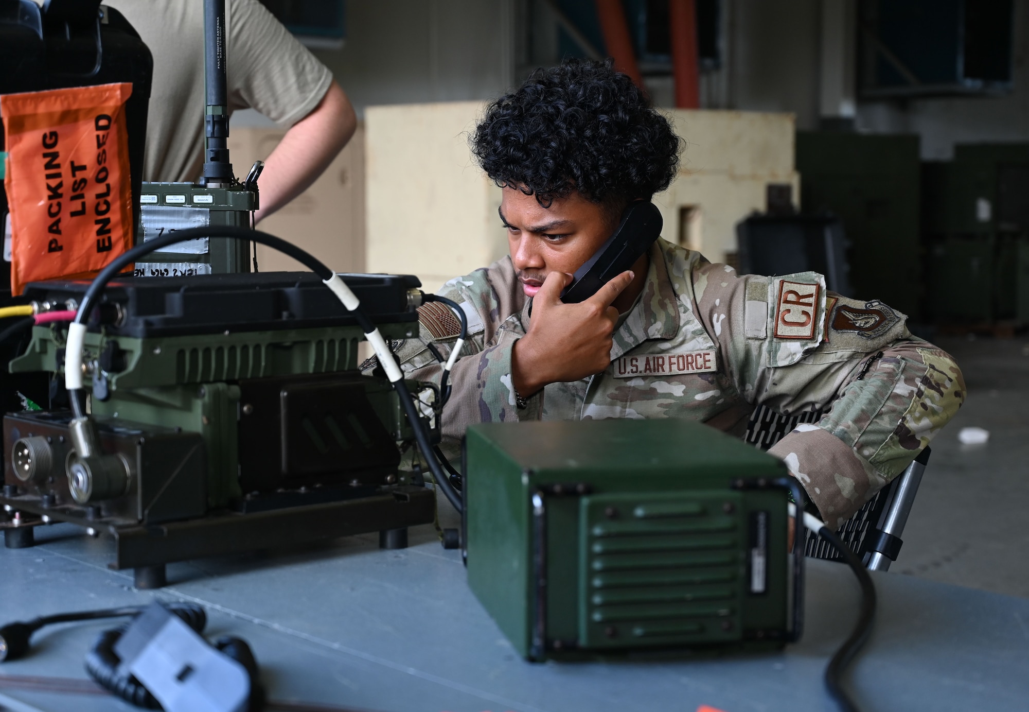 An Airman tests high frequency radio.