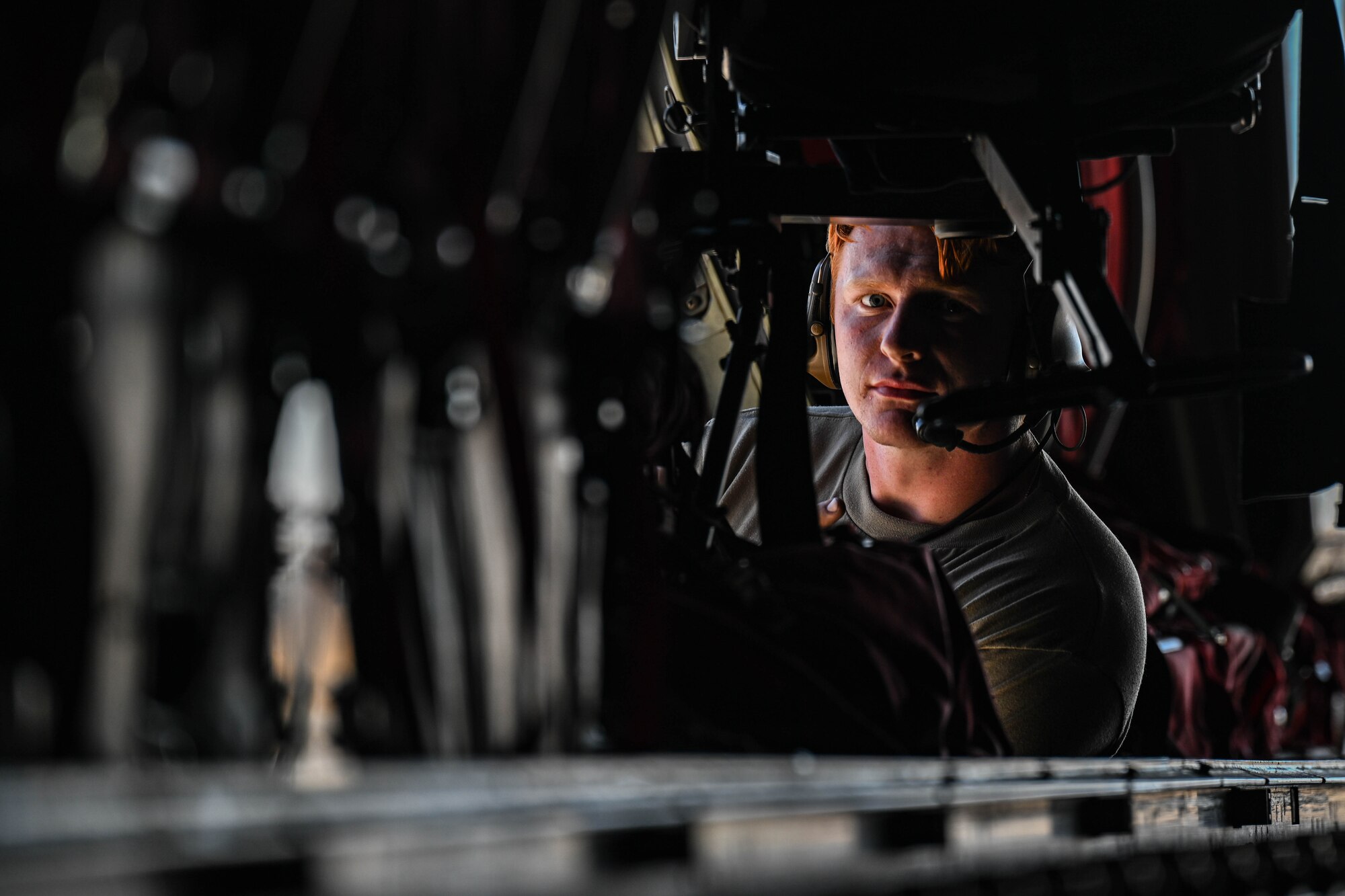 A man looks through the interior of a C-130J Super Hercules Aircraft.