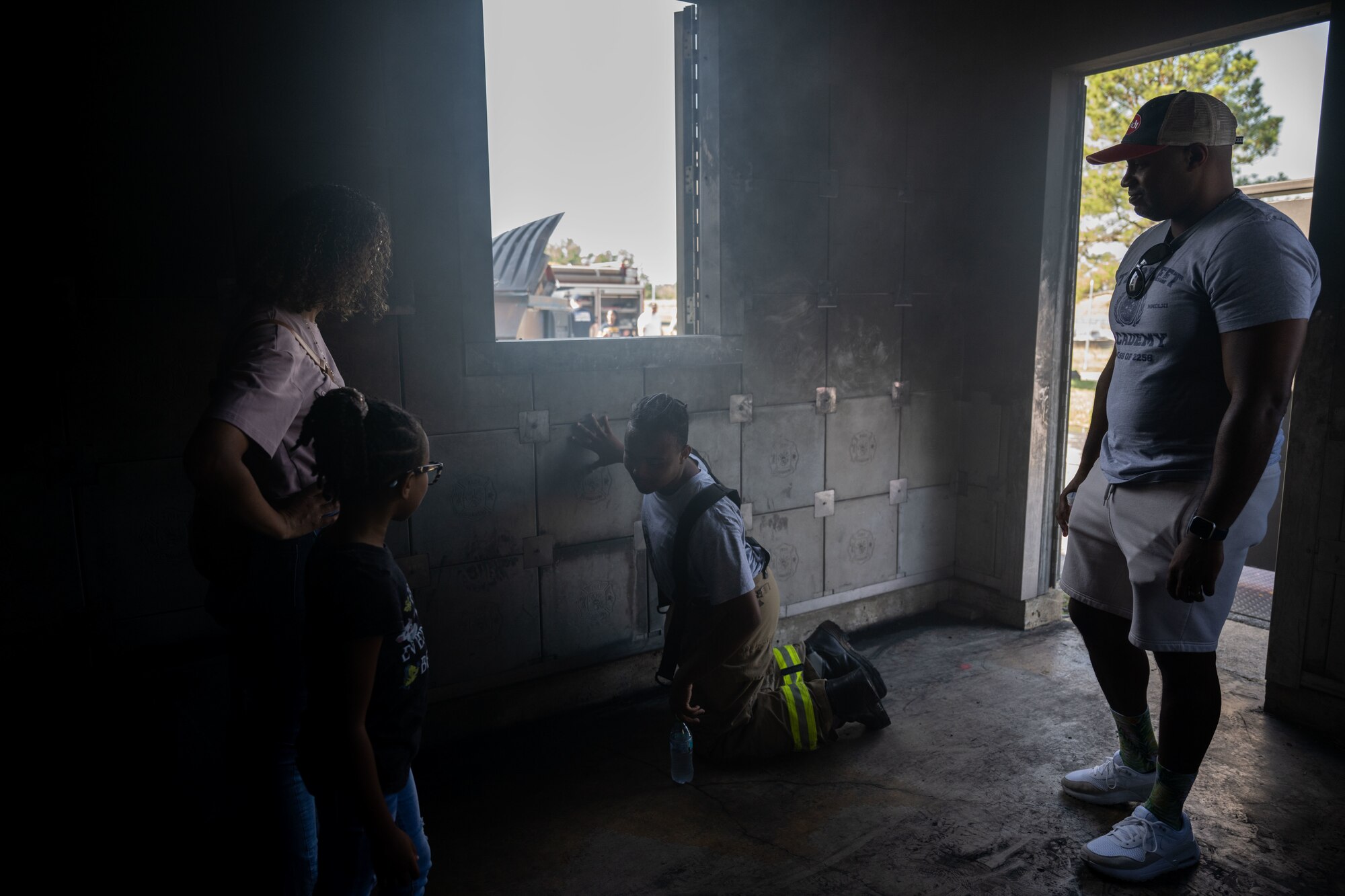 Family goes through smokey room