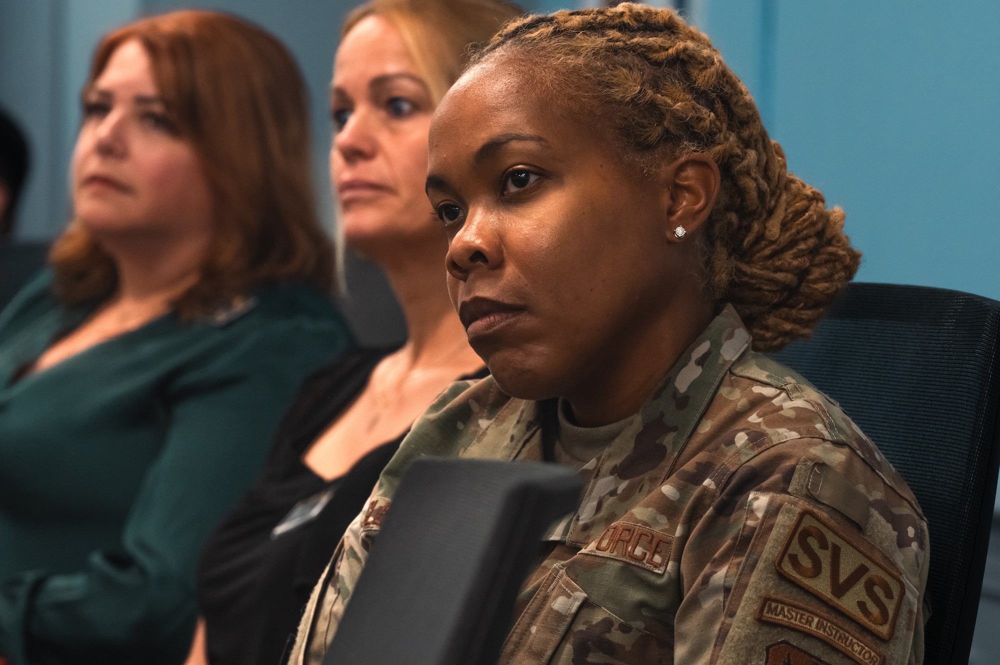 individuals listen to a brief at the Airey NCO Academy open house