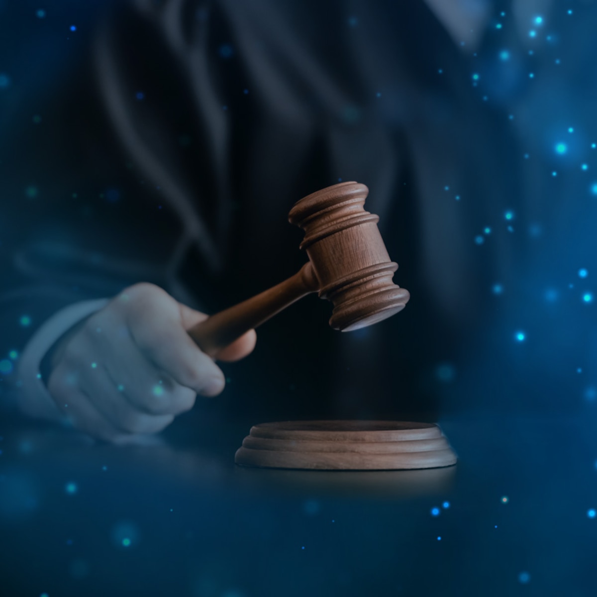 Judge's hand rapping a gavel [image is not public domain]