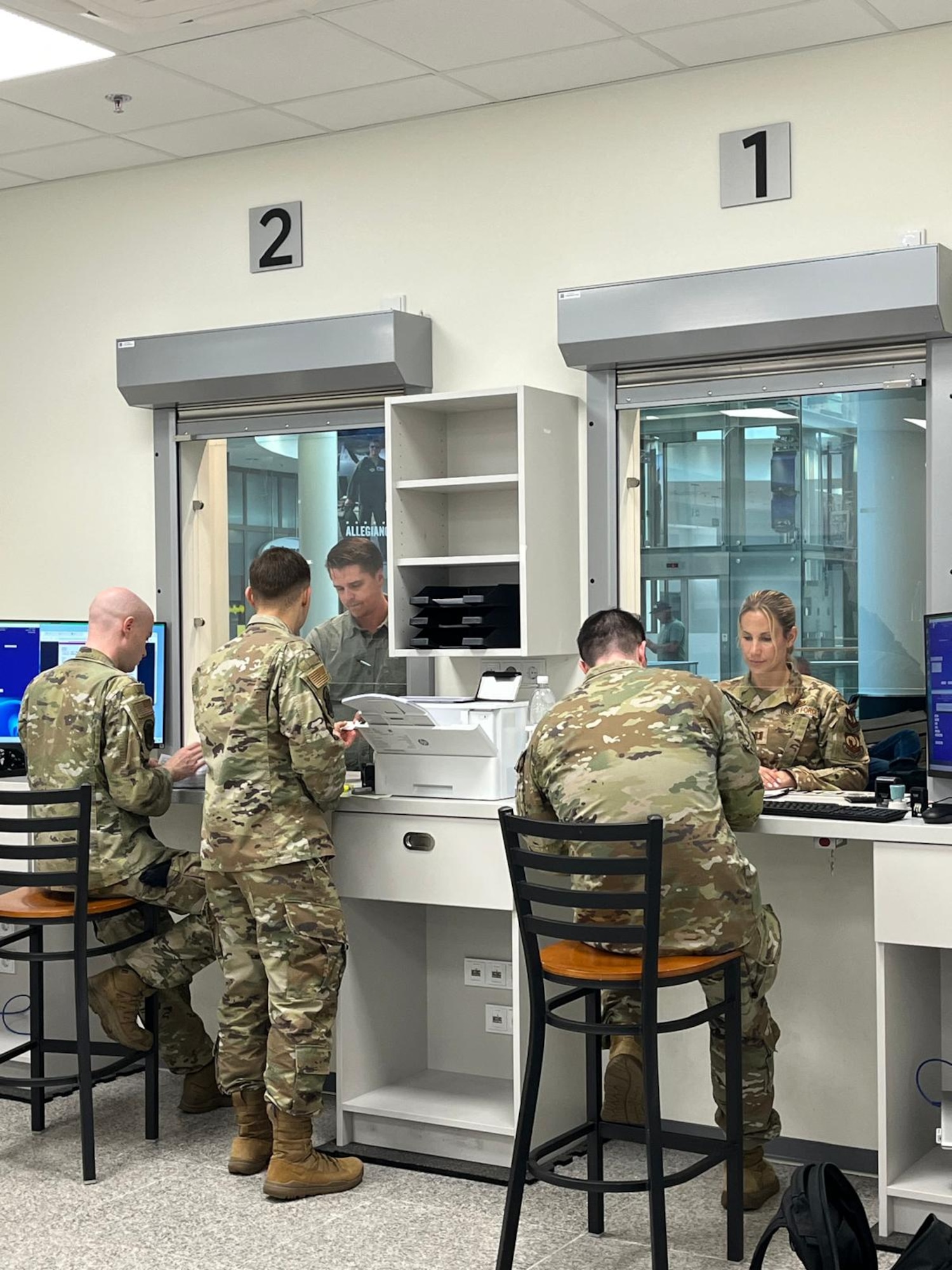 Airmen assist customers at vehicle registration substation
