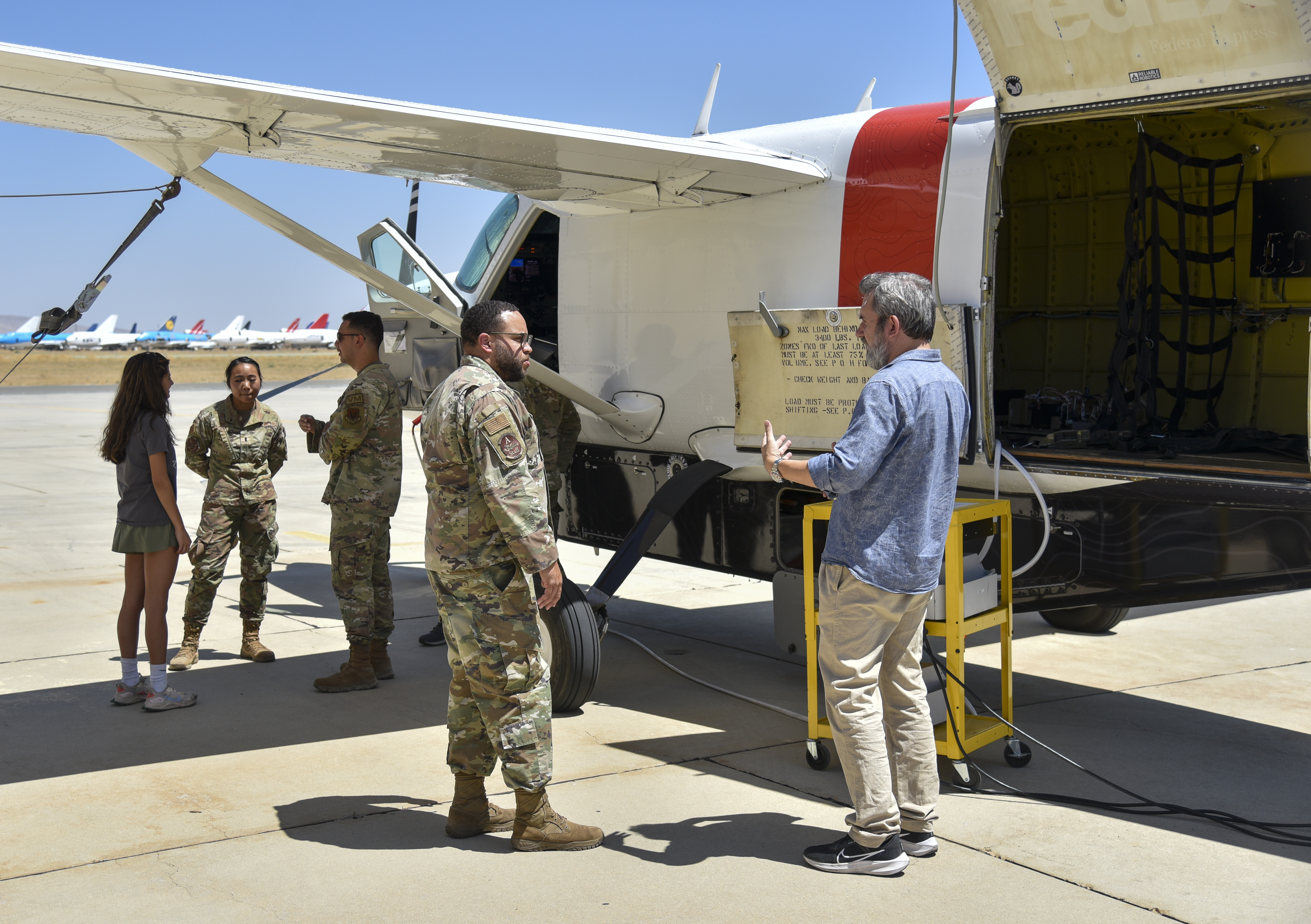 Reliable Robotics, an AFWERX Autonomy Prime partner, gives Airmen a tour of their autonomous Cessna 208B Grand Caravan during AGILE FLAG 24-3 at Mojave Air and Space Port, California, on Aug. 9, 2024.
