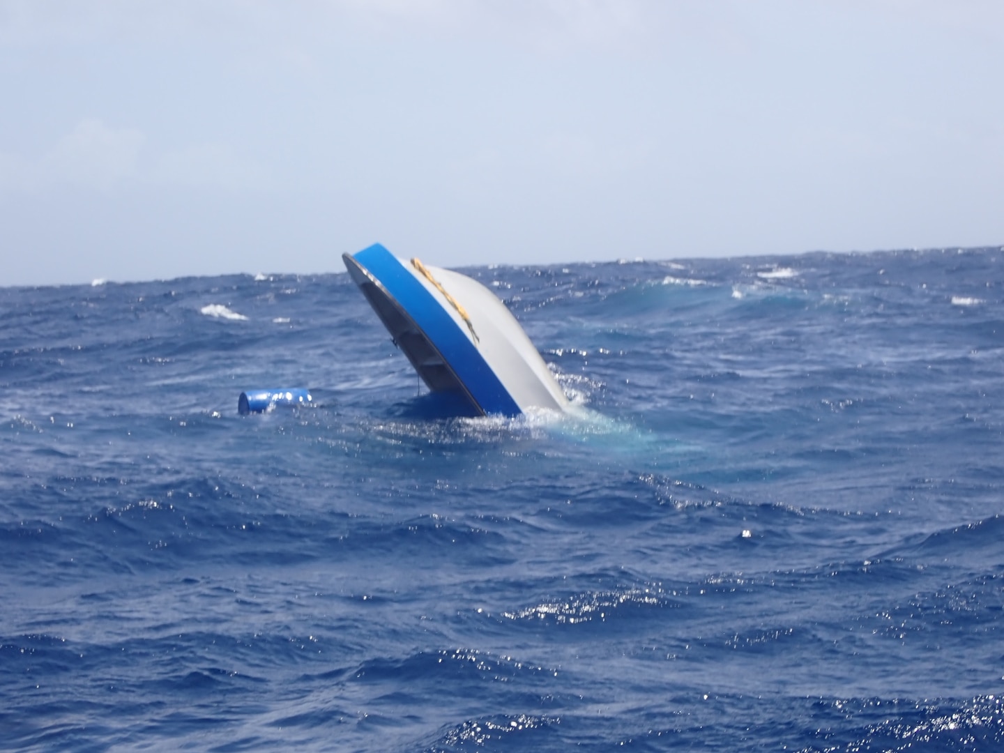 A suspected drug smuggling vessel sinking in the Caribbean Sea on July 24, 2024. The alleged smugglers were rescued by small boat crews from the USS St. Louis after their vessel began taking on water. (Courtesy asset)