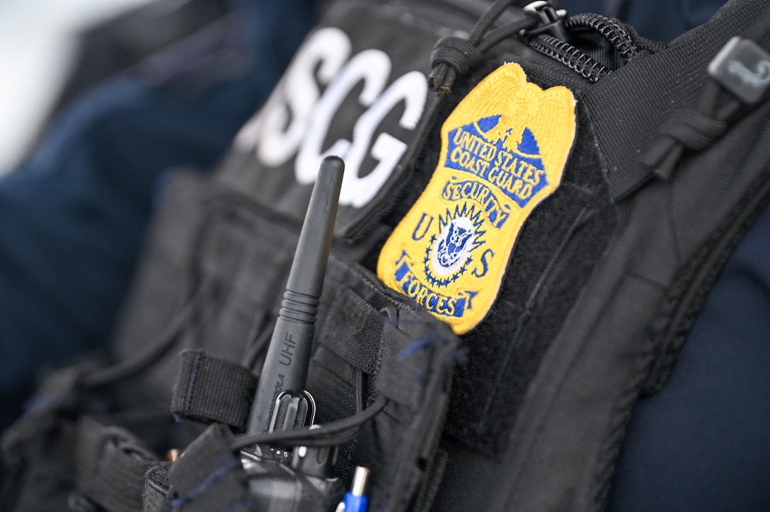 A detail shot of the Coast Guard security forces badge at Base Miami Beach on August 14, 2024. Coast Guard security forces ensure the accountability and security of offloaded contraband. (U.S. Coast Guard photo by Petty Officer 3rd Class Nicholas Strasburg)