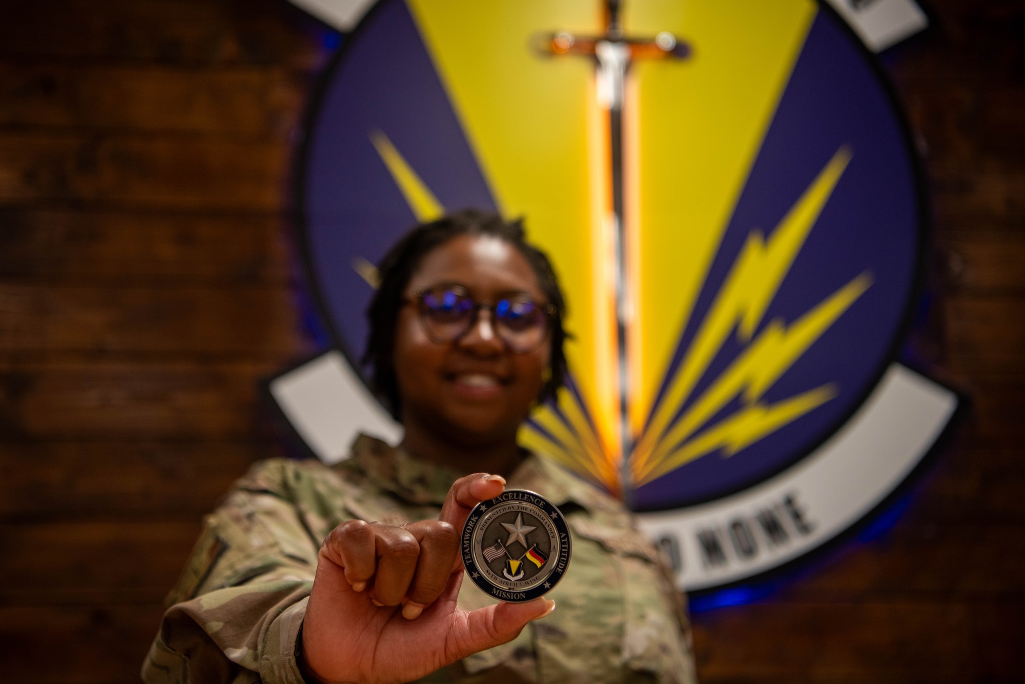 Airman is coined for Airlifter of the Week.