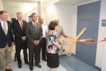 Program Director Susan Corrigan cuts the ribbon July 23 to officially open the STARBASE Academy in Winchester. (Photo by Cotton Puryear, Virginia National Guard)