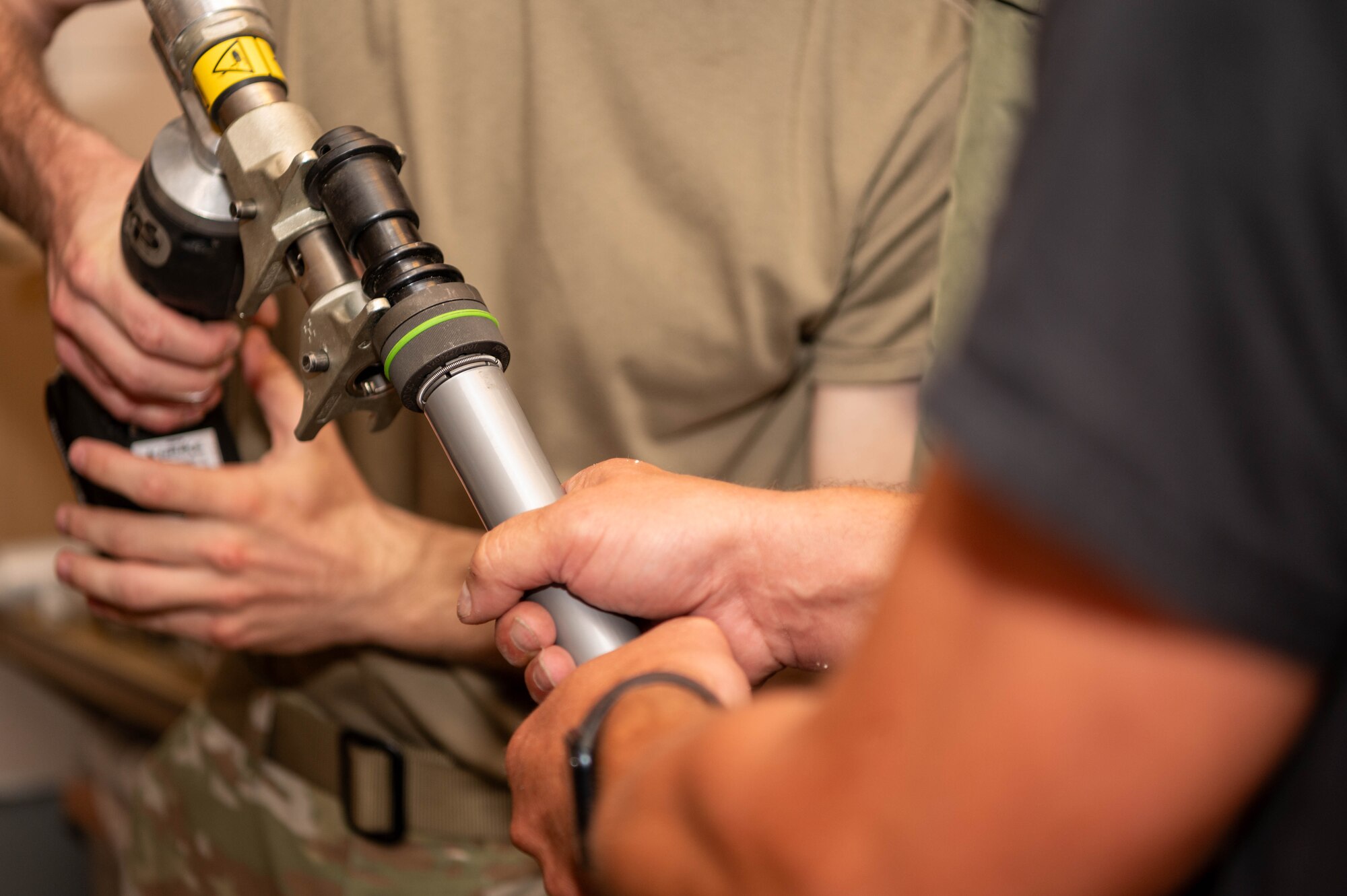 A pipe fitting is being put on a pipe.