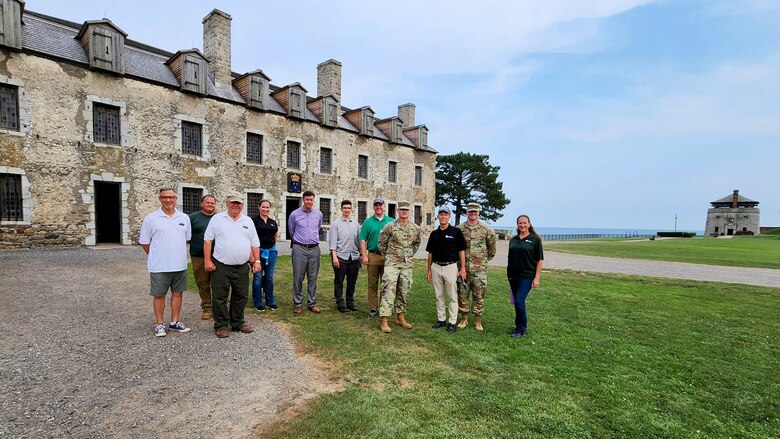 People stand in front of French Castle at historic Old Fort Niagara in Youngstown, New York