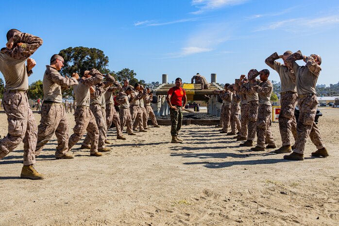 U.S Marine Corps recruits with Bravo Company, 1st Recruit Training Battalion, execute Marine Corps Martial Arts Program techniques during a confidence course training event at Marine Corps Recruit Depot San Diego, California, Aug. 5, 2024. The confidence course challenges recruits physically and mentally through obstacles that require confidence in their strength, balance, and determination. (U.S. Marine Corps photo by Lance Cpl. Eric Valerio)