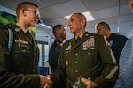 Command Sgt. Maj. John T. Raines, right, the command sergeant major of the Army National Guard, shakes hands with Spc. Tevin Kenton, an infantryman representing the Wisconsin Army National Guard, Aug. 8 at the closing ceremony of the 2024 Army National Guard Best Warrior Competition, Burlington, Vt. The Army National Guard Best Warrior Competition is a five-day event composed of 14 competitors representing the regional winners; the competition tests Soldiers’ physical and mental prowess with a series of events with the overall winners receiving either Soldier of the Year or Non-commissioned Officer of the Year recognition. U.S. Army National Guard photo by Sgt. Lianne M. Hirano