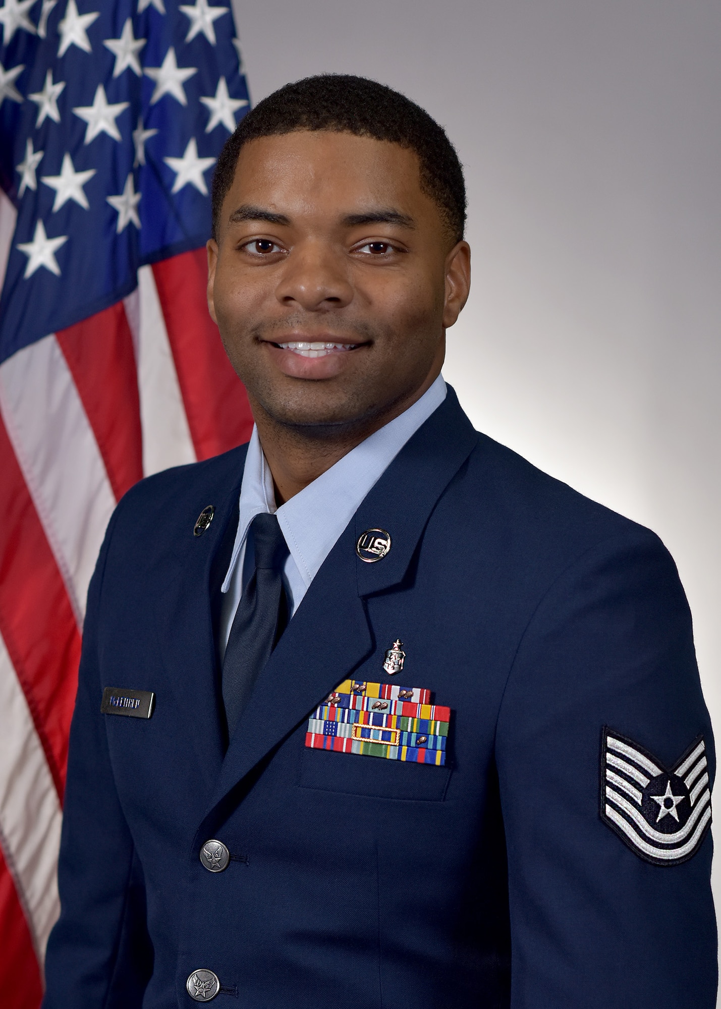 Tech. Sgt. Aaron McKeithen, TRICARE Operations & Patient Administration (TOPA) Flight Chief, 61st Medical Squadron, Los Angeles Air Force Base, El Segundo, Calif., poses for his official military portrait.
