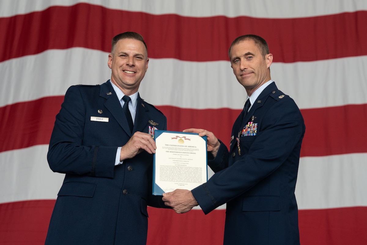 An Airman is presented with an award