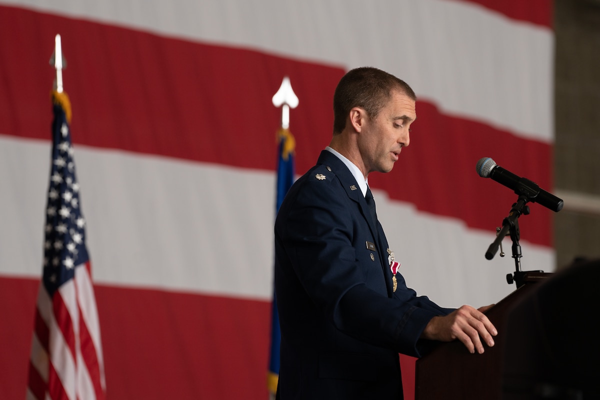 An Airman speaks at a podium