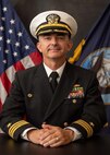 Cmdr. JAMES A. WALKER