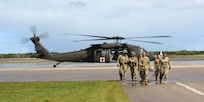 U.S. Air Force aerospace medical technicians with the 127th Medical Group, Michigan Air National Guard, and a U.S. Army Soldier assigned to the 3rd Battalion, 238th Aviation Regiment, General Support Aviation Battalion, Michigan Army National Guard, participate in en-route patient staging system training during Northern Strike 24-2 at Alpena Combat Readiness Training Center, Michigan, Aug. 10, 2024.