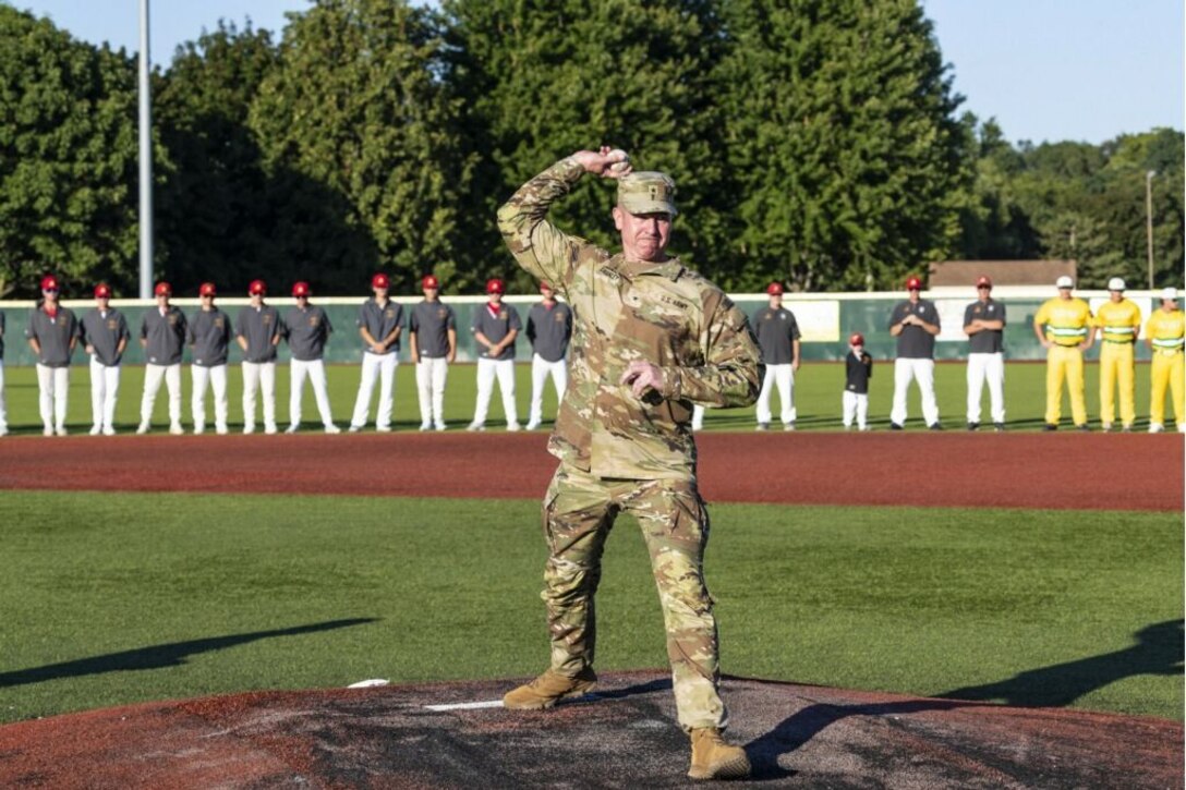 Brig. Gen. Michael Shanley, Commanding General, 85th U.S. Army Reserve Support Command, delivers a ceremonial first pitch to open the American Legion Great Lakes Regional Baseball tournament, August 7, 2024.