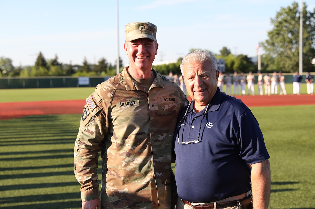 Brig. Gen. Michael Shanley, Commanding General, 85th U.S. Army Reserve Support Command, pauses for a photo with Mayor Frank Saverino, Mayor, Carol Stream, Illinois, during the American Legion Post 76-hosted state champion baseball tournament for the Great Lakes region, August 7, 2024, at Lee Pfund field.