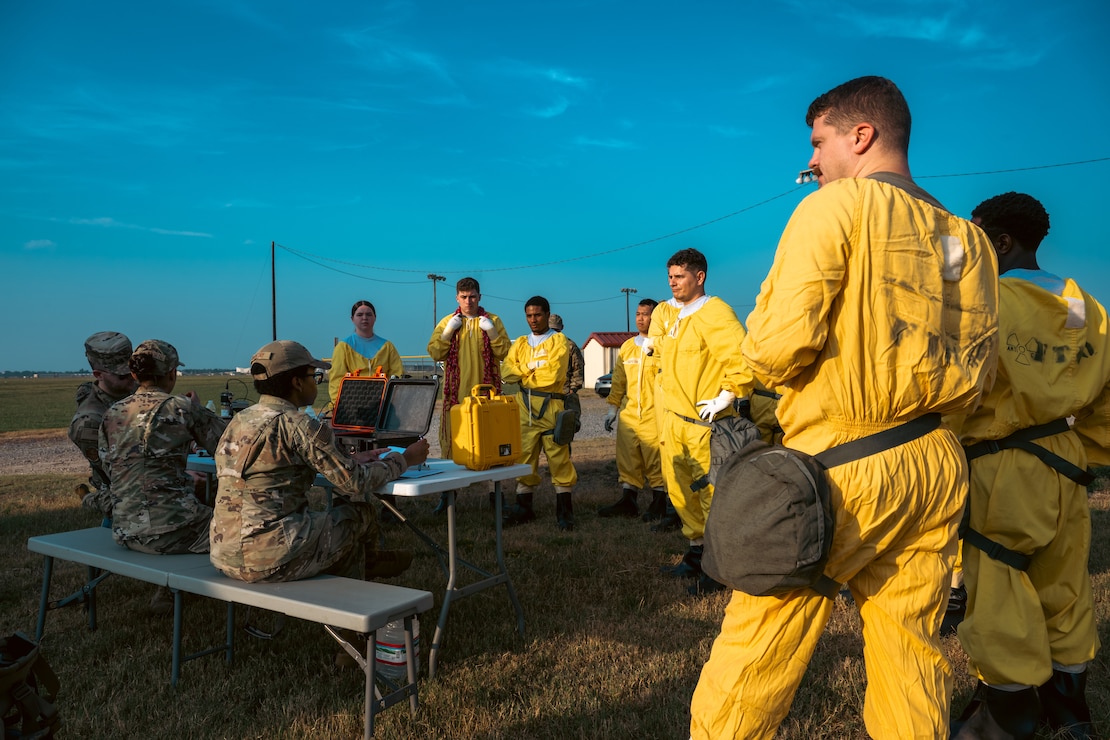 Bioenvironmental engineering specialists give an electronic personal dosimeter briefing during exercise Bayou Guarantee at Barksdale Air Force Base, La., August 14, 2024. EPDs give responders immediate feedback about any potential radiation they may be exposed to. (U.S. Air Force Photo by Senior Airman Seth Watson)