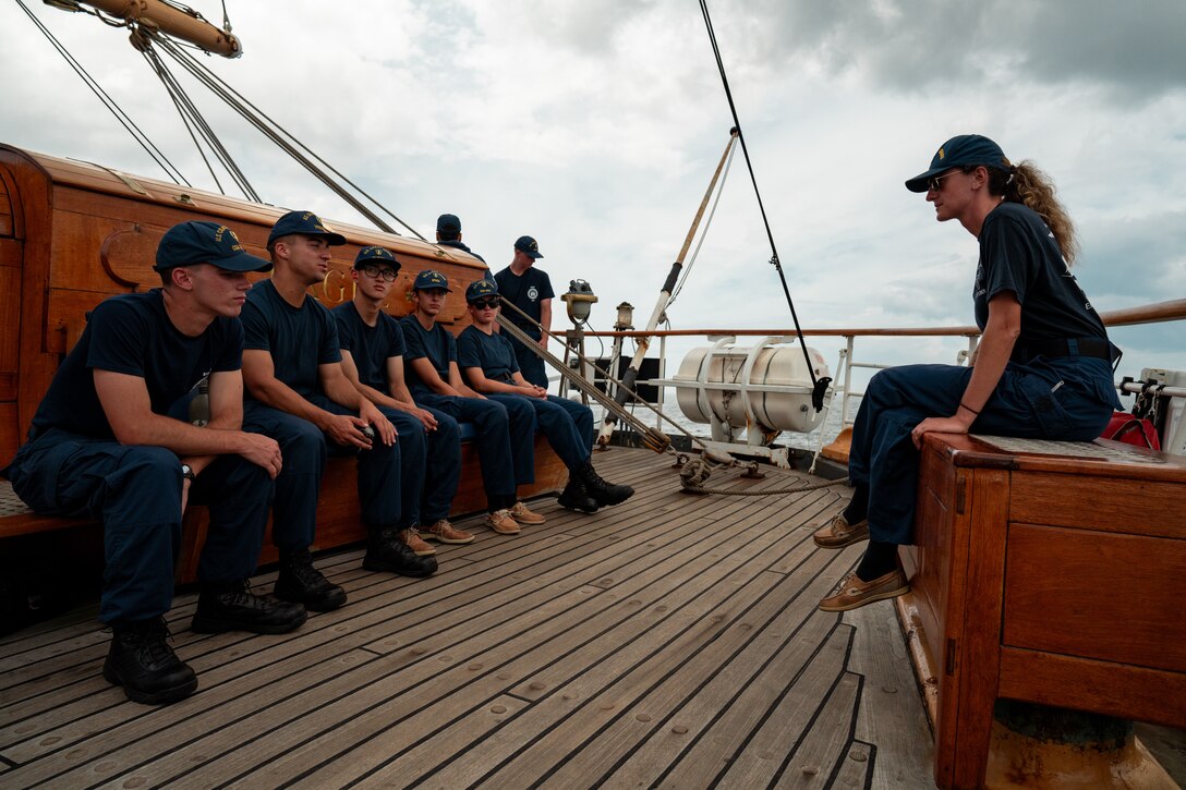 U.S. Coast Guard Lt. Victoria Sparacino trains Coast Guard Academy cadets in seamanship while aboard Coast Guard Cutter Eagle (WIX 327) in the Atlantic Ocean, Aug. 1, 2024. Eagle is a 295-foot, three-masted barque used as a training vessel for future officers of the United States Coast Guard.