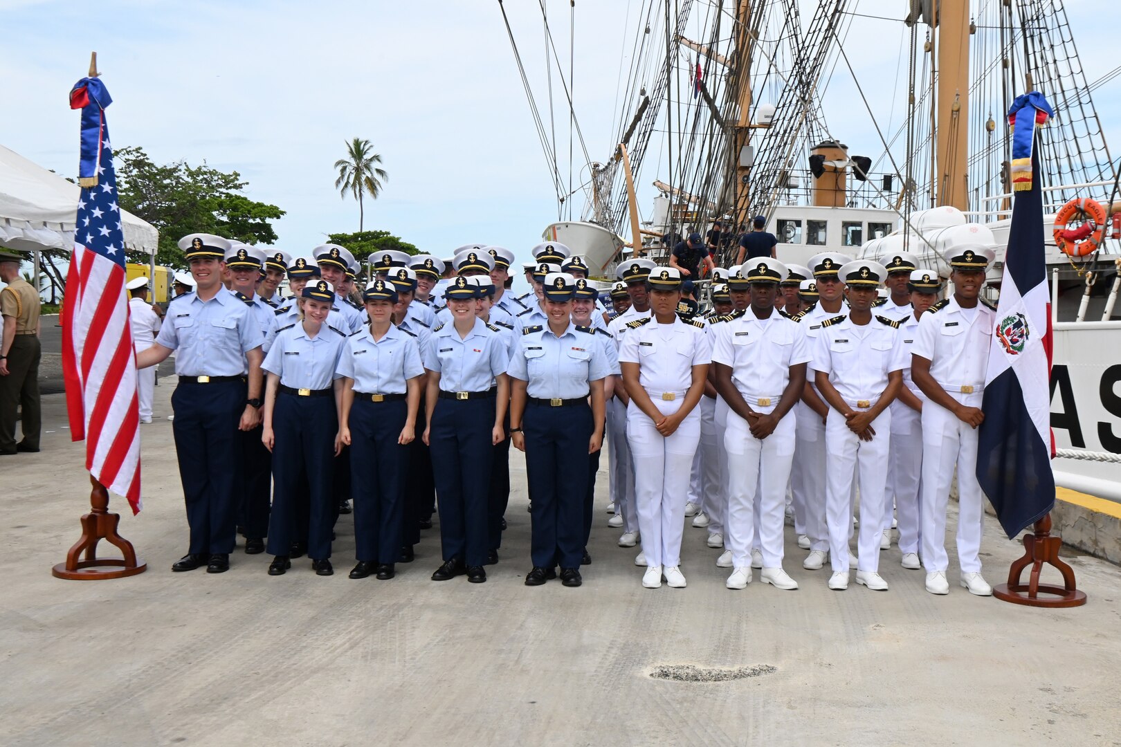 Cadets from the U.S Coast Guard Academy and the Naval Academy of the Dominican Republic pose for a photo in front of the U.S. Coast Guard Cutter Eagle in Santo Domingo, Dominican Republic, May 25, 2024. The cutter serves as a training platform for the U.S. Coast Guard cadets.