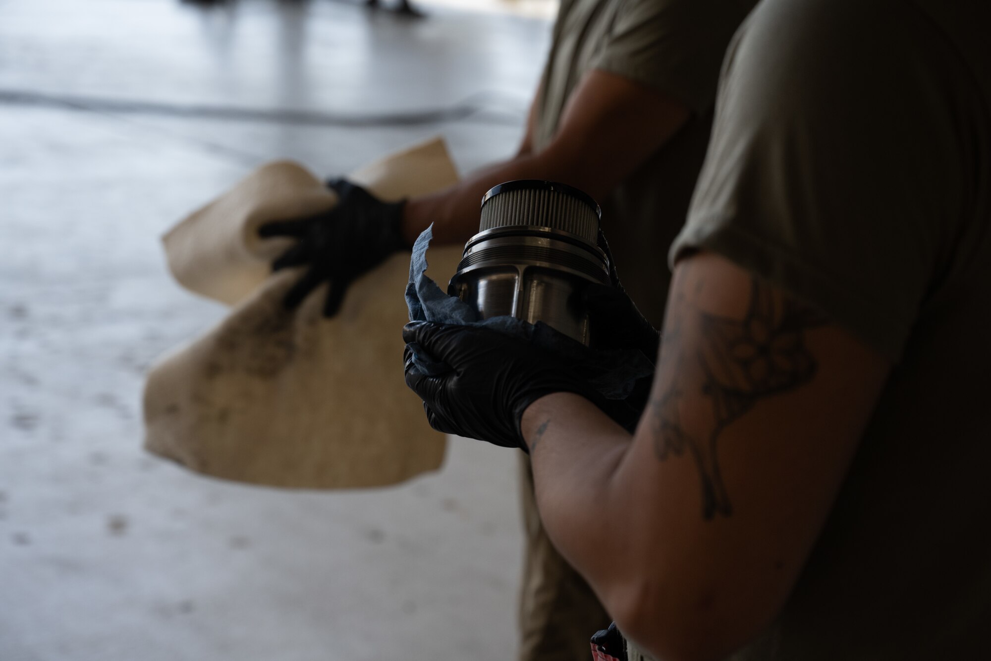 Airman holds safety wire.