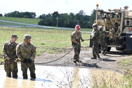 Soldiers with Delta Company, 128th Brigade Support Battalion, 2nd Infantry Brigade Combat Team, 28th Infantry Division conduct vehicle extraction training in a mire pit at Fort Indiantown Gap, Pa., on Aug. 11, 2024, during their annual training. (U.S. Army National Guard photo by Spc. Jessica Barb)
