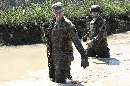 Soldiers with Delta Company, 128th Brigade Support Battalion, 2nd Infantry Brigade Combat Team, 28th Infantry Division conduct vehicle extraction training in a mire pit at Fort Indiantown Gap, Pa., on Aug. 11, 2024, during their annual training. (U.S. Army National Guard photo by Spc. Jessica Barb)