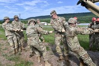 Soldiers with Delta Company, 128th Brigade Support Battalion, 2nd Infantry Brigade Combat Team, 28th Infantry Division conduct vehicle extraction training in a mire pit at Fort Indiantown Gap, Pa., on Aug. 11, 2024, during their annual training. (U.S. Army National Guard photo by Spc. Jessica Barb)