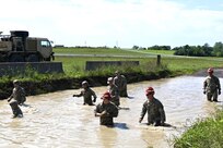 Soldiers with Delta Company, 128th Brigade Support Battalion, 2nd Infantry Brigade Combat Team, 28th Infantry Division conduct vehicle extraction training in a mire pit at Fort Indiantown Gap, Pa., on Aug. 11, 2024, during their annual training. (U.S. Army National Guard photo by Spc. Jessica Barb)