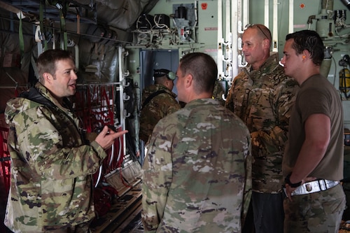Four Airmen in conversation