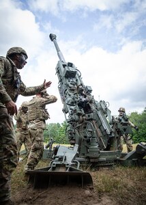 Members of Charlie Battery, 1st Battalion, 160th Field Artillery Regiment, 45th Infantry Brigade Combat Team, Oklahoma Army National Guard, fire an M777 towed 155 mm howitzer during Exercise Northern Strike 2024 at Camp Grayling, Michigan, Aug. 11, 2024. NS 24-2 is a Reserve component training event focusing on joint readiness training to build interoperability and strengthen partnerships in an all-domain environment.