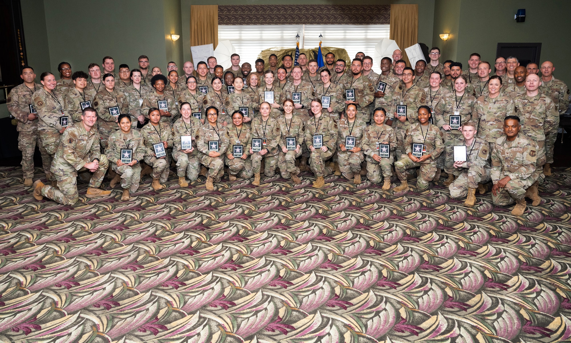 A large group of people wearing camouflage uniforms.
