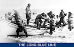 Soaked and tired, a U.S. Life-Saving Service crew lands the rescued survivors of a shipwreck. (U.S. Coast Guard)