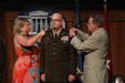 U.S. Army Brig. Gen. Andy Bates’ wife, Tiffany, and his father, Dr. John Bates, pin on his stars during his promotion ceremony held at Metro Hall in Louisville, Ky., Aug. 7, 2024.. Bates has served 33 years in the Active Army and the National Guard and on the civilian side, his's worked for Louisville Metro Government for 26 years. (U.S. Army National Guard photo by Sgt. 1st. Class Benjamin Crane)