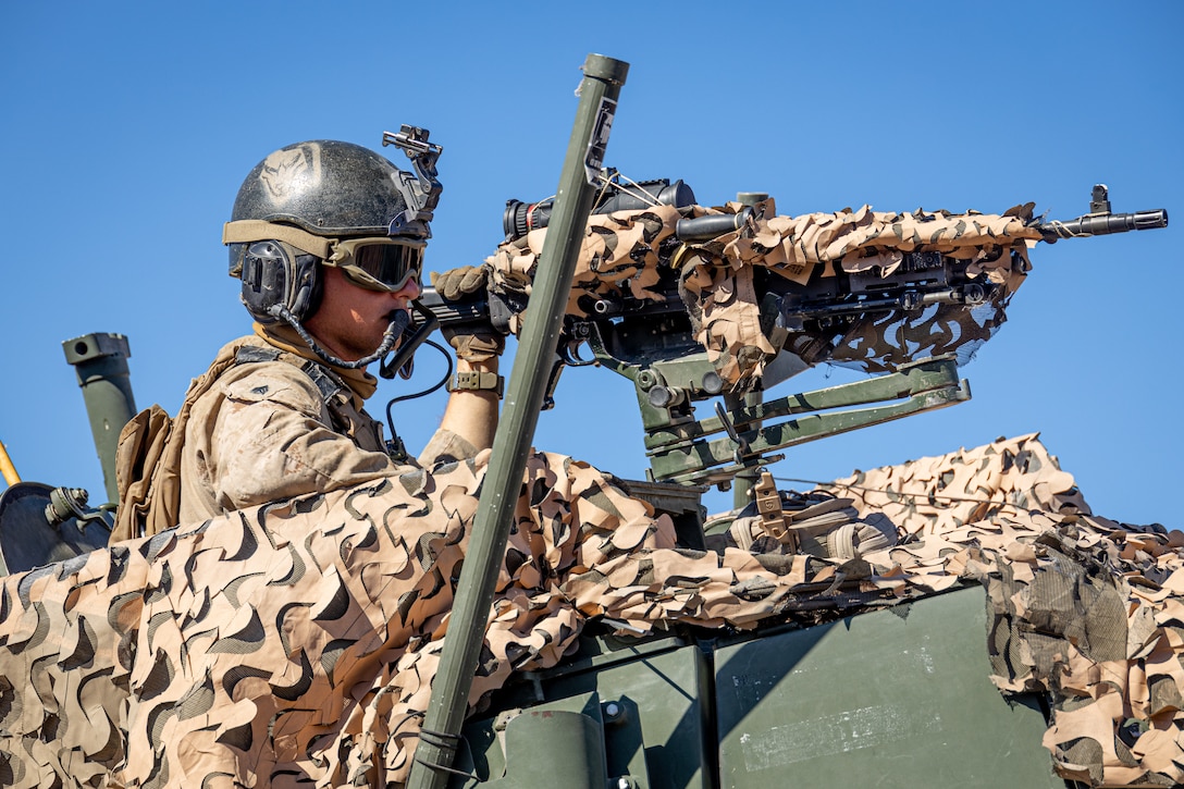 U.S. Marine Corps Sgt. Jonah Hollis, an Indianapolis, Indiana native, vehicle commander with 2nd Light Armored Reconnaissance Battalion, 2nd Marine Division, II Marine Expeditionary Force, provides suppressive fire during an Integrated Training Exercise as part of Service Level Training Exercise 5-24 at Training Area East, Marine Corps Air-Ground Combat Center, Twentynine Palms, California, July 29, 2024. The platoon attacks provide crucial training that prepares Marines to execute real-world operations with precision and effectiveness, ensuring they are ready to respond to any threat. SLTE 5-24 is purpose built to train, develop, and validate the Infantry Battalion Experiment as part of a larger Marine Air-Ground Task Force operation as a Stand-in Force across a contested multi-domain distributed environment. (U.S. Marine Corps photo by Lance Cpl. Enge You)