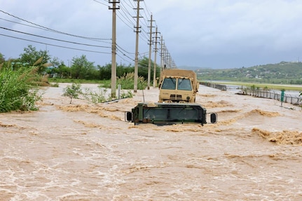 U.S. Citizen-Soldiers assigned to the 125th Military Police Battalion (Task Force South) and the Indian Company of the 1-296th Infantry Regiment (Task Force West), both from the 92nd Military Police Brigade, evacuate residents at Ponce, Puerto Rico, Aug. 14, 2024. The Puerto Rico Army National Guard rescued people in areas flooded by Tropical Storm Ernesto.