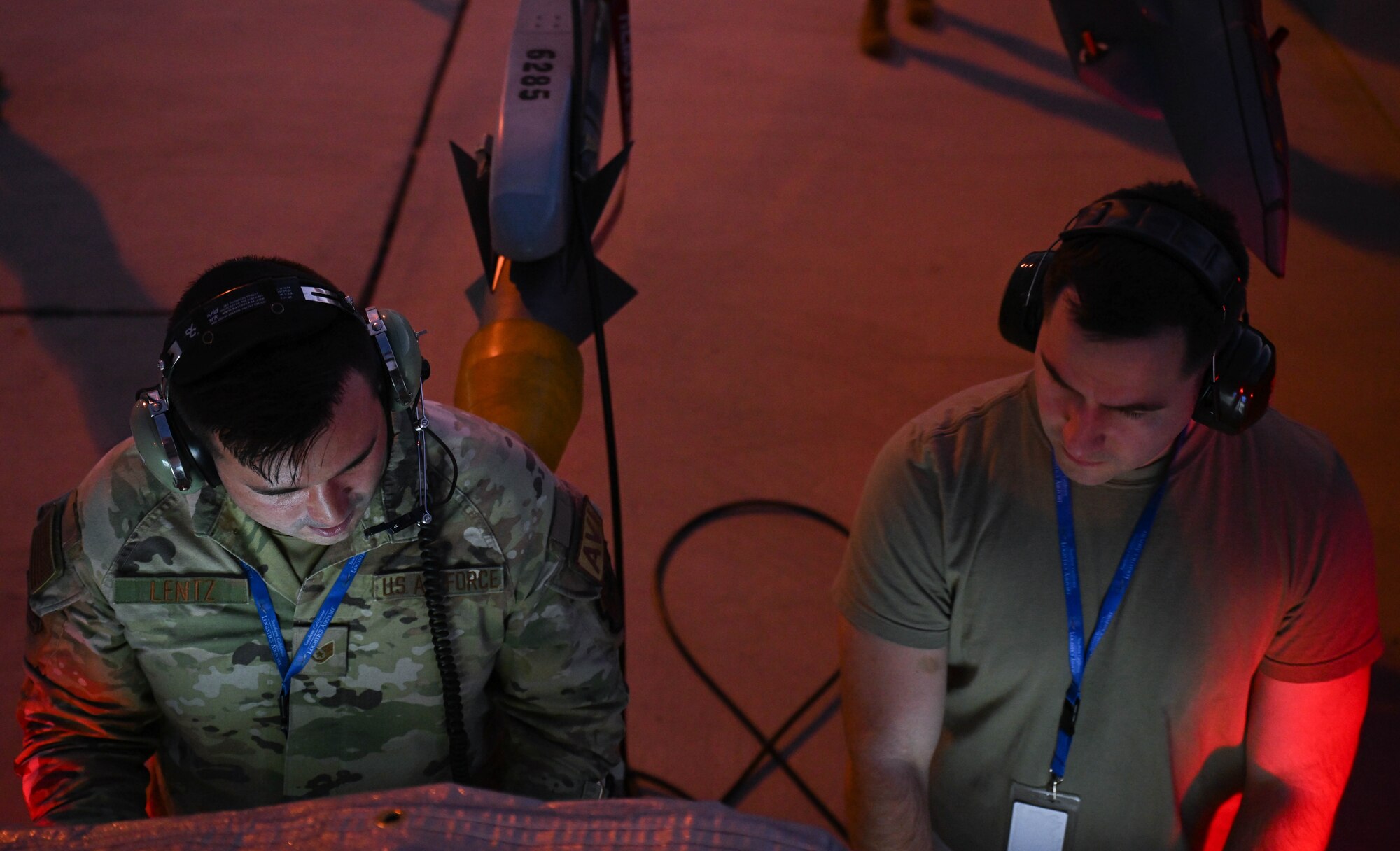 U.S. Air Force Staff Sgt. Stephen Lentz, left, and U.S. Air Force Staff Sgt. Preston Leeling, right, both 87th Electronic Warfare Squadron Combat Shield avionics electronic warfare (EW) technicians, power up the AN/USM-642A during Bamboo Eagle 24-3 at Southern California Logistics Airport, Victorville, California, Aug. 5, 2024. The exercise took place across several locations in California and in airspace over the eastern Pacific Ocean, testing the capabilities of the Air Force, specifically focusing on distributed command and control, disaggregated mission generation and the joint maritime environment. (U.S. Air Force photo by Senior Airman Anna Smith)