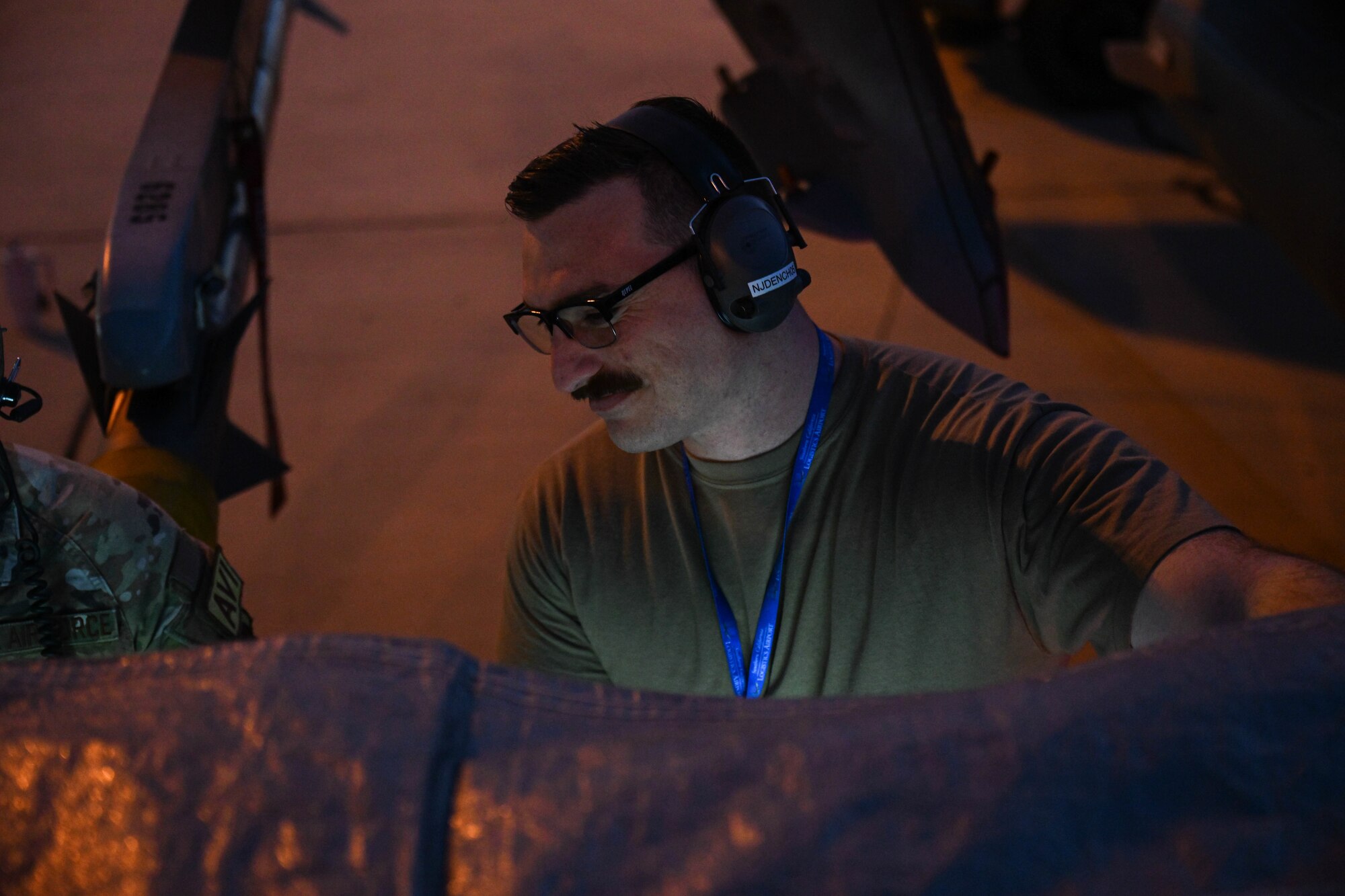 U.S. Air Force Tech. Sgt. Daniel Felice, 87th Electronic Warfare Squadron Combat Shield avionics electronic warfare (EW) technician, assesses the defensive system readiness of a U.S. Air Force F-16 Fighting Falcon during Bamboo Eagle 24-3 at Southern California Logistics Airport, Victorville, California, Aug. 5, 2024. Approximately 3,000 U.S. service members from across four military branches are expected to fly, maintain and support more than 150 aircraft from 24 units in more than 10 locations during Bamboo Eagle. (U.S. Air Force photo by Senior Airman Anna Smith)