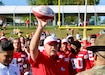 At this year's Kansas City Chiefs training camp, head coach Any Reid took a moment to honor the military presence by presenting a football to one of the Soldiers in attendance.  The gesture was part of the Chief's Military Appreciation Day activities, reflecting the team's deep respect for the Armed Forces.