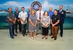 FY23 NAVSEA Excellence in Facilities Engineering & Management
Facilities Engineering Management Team
(left to right) Christopher Owens, Gordon Griffith, Cyril Gazagnaire, Stephen Locke, Carmen Ferrer, William Logsdon, Staci Matthewson, Randall Lee, Jason Zimmermen, and 1st Lt. Ryan Ison. 
(Not pictured: Adrienne Brookes, Frances Negron, Danniel Riveras, 
Patrick Beacom, Kelley Close, and Capt. Kyle Boesch)