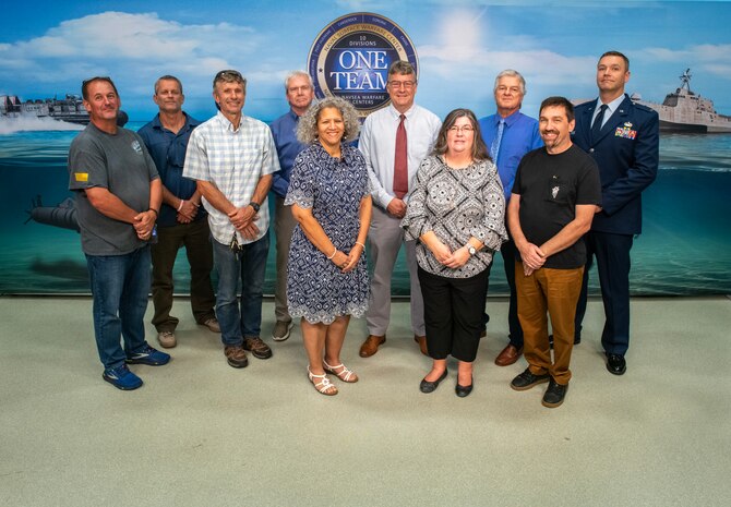 FY23 NAVSEA Excellence in Facilities Engineering & Management
Facilities Engineering Management Team
(left to right) Christopher Owens, Gordon Griffith, Cyril Gazagnaire, Stephen Locke, Carmen Ferrer, William Logsdon, Staci Matthewson, Randall Lee, Jason Zimmermen, and 1st Lt. Ryan Ison. 
(Not pictured: Adrienne Brookes, Frances Negron, Danniel Riveras, 
Patrick Beacom, Kelley Close, and Capt. Kyle Boesch)