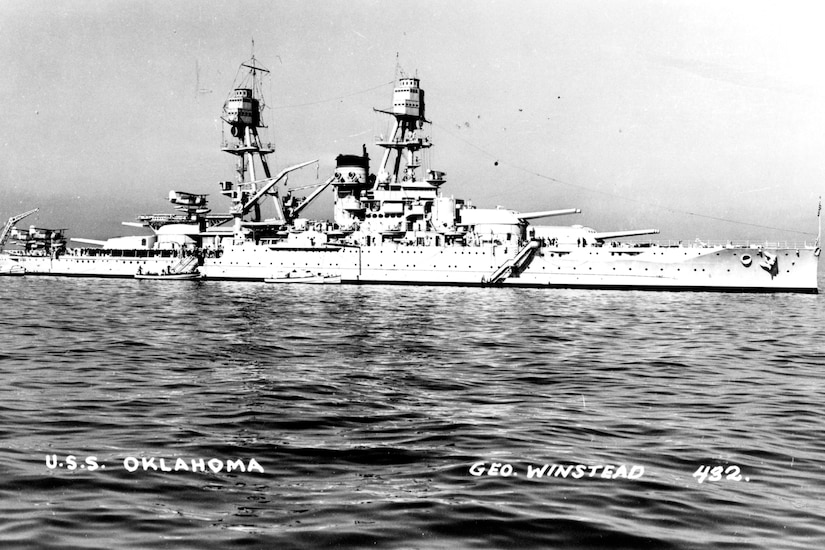 Black-and-white image of a battleship at sea.