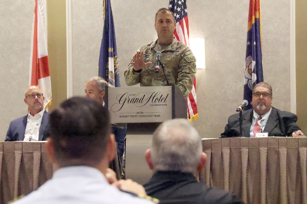 Man speaking at podium.