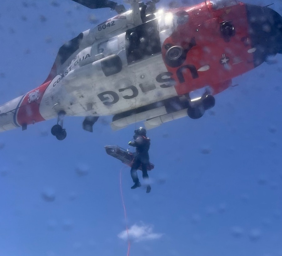 An MH-60 Jayhawk helicopter air crew from Air Station Clearwater hosts a 51-year-old man from a fishing boat 45 miles west of Anna Maria Island, Florida, Aug. 16, 2024. The 51-year-old man was medevaced to Tampa General Hospital for further care. (U.S. Coast Guard Station St. Petersburg photo)